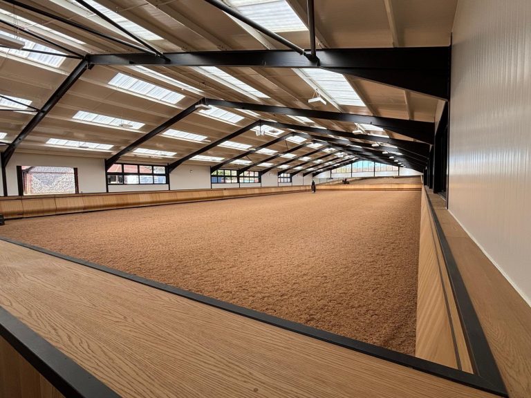 Photo of high end indoor riding arena with oak finish